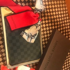 Louis Vuitton’s Pochette Jour PM-Damier Graphite